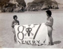Girls on beach with 87th Banner